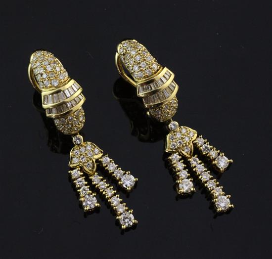 A pair of modern 18ct gold and diamond set tassel drop earrings, approx. 1.75in.